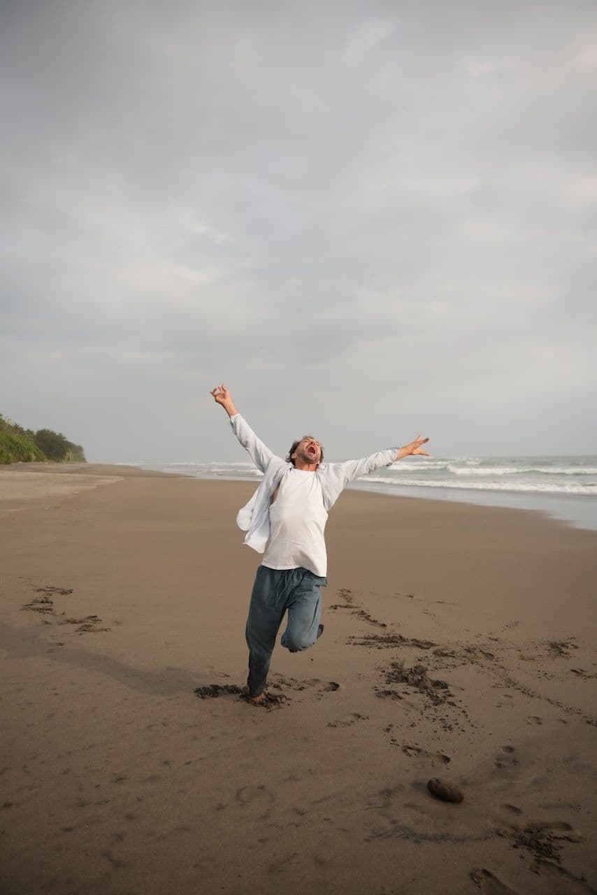 Miki on the beach, arms wide open