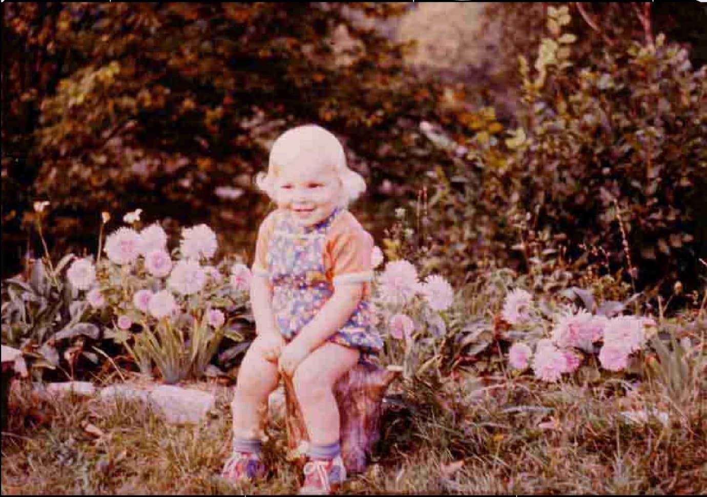 Miki as a toddler among flowers, 1981