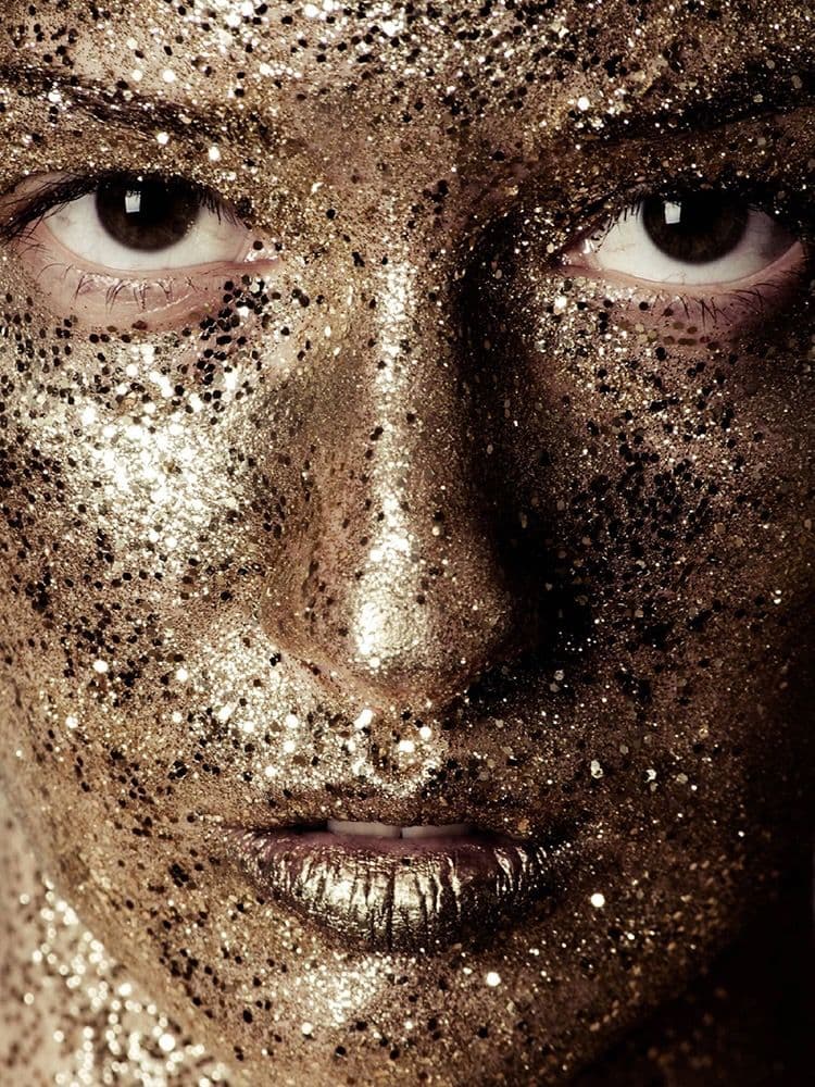 Portrait with gold glitter make-up