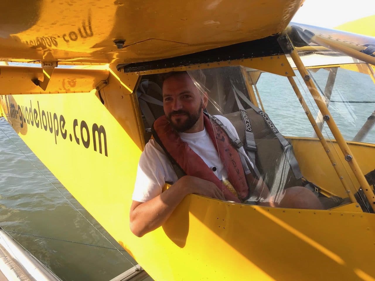 In the cockpit of a yellow seaplane